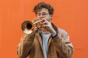 gefen_23233_a_young_white_man_playing_trumpet_with_a_blank_brig_42e77033-1d65-4fb1-ad2e-4090407f3dbb-2
